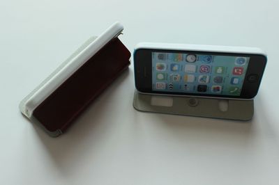 IPHONE 5C 双开窗支撑电压带钻皮套 功能、特色与市场价值